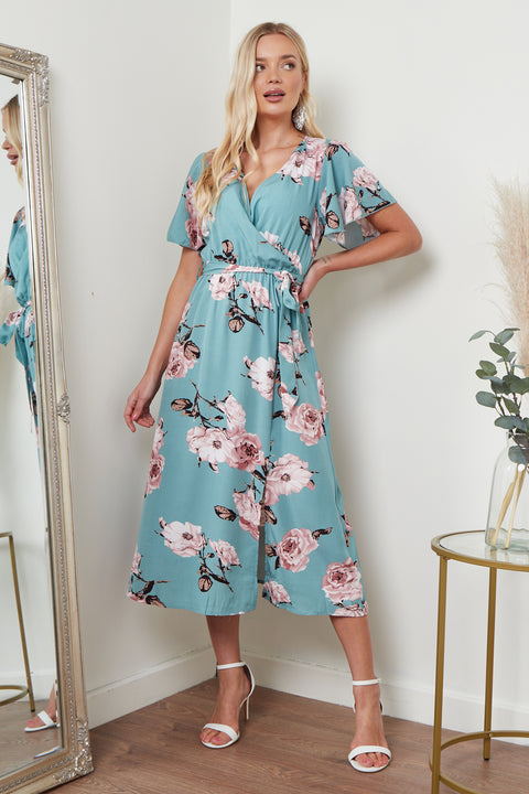 Image of Lilura London's Angel Sleeves Midi Wrap Dress in a vibrant green floral print