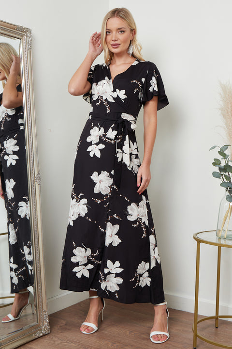 Image of a black floral print wrap front maxi dress from Lilura London