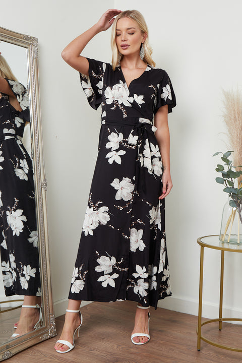 Image of a black floral print wrap front maxi dress from Lilura London